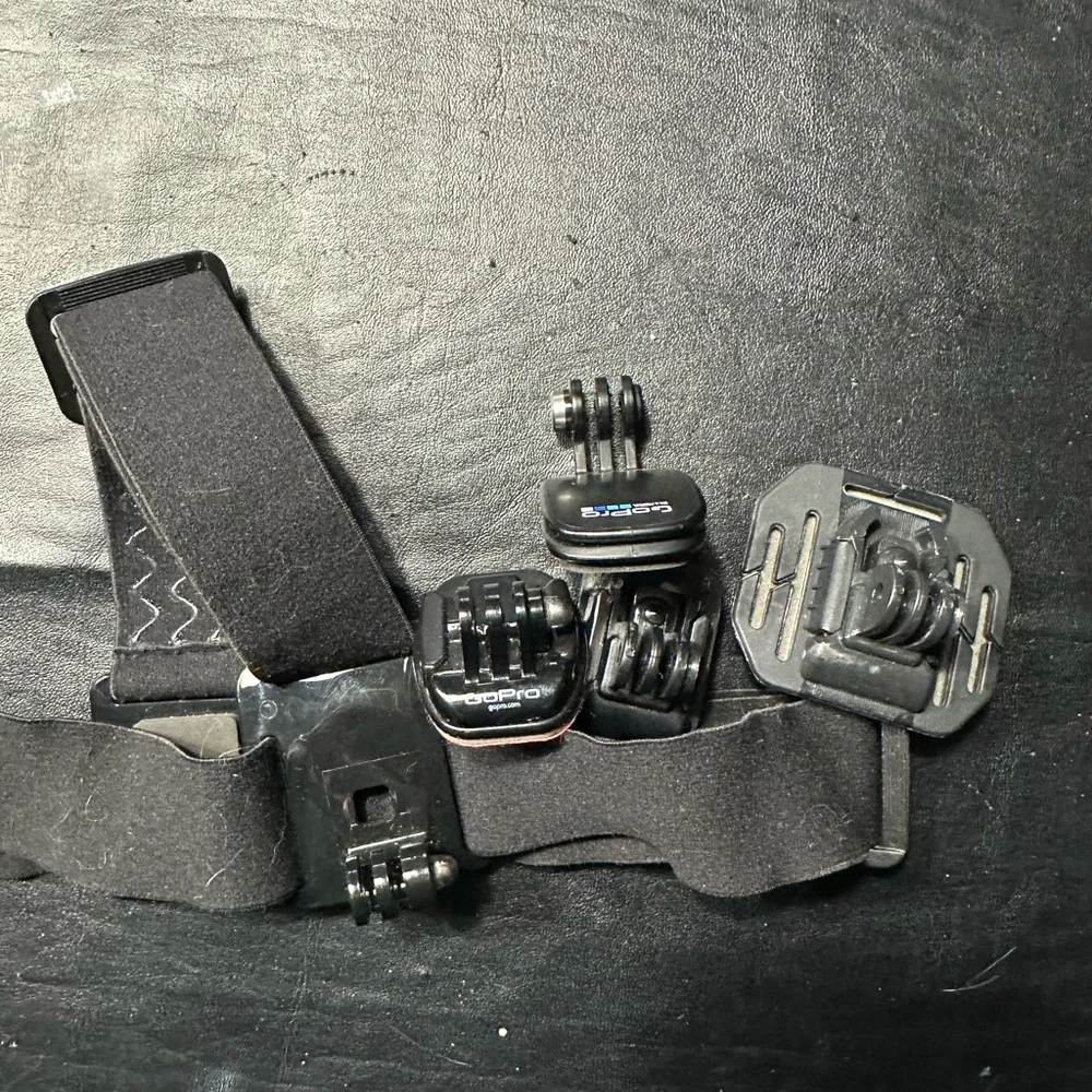 Bundle of Go Pro Head Mount, 3 Stick Mounts , Clip, Charger and Thumbscrews